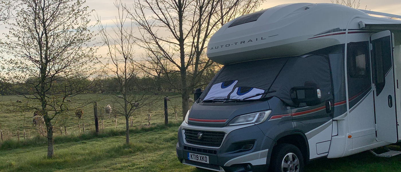 Fiat Ducato based motorhome fitted with a BusEyes Grey Thermal wrap around windscreen cover